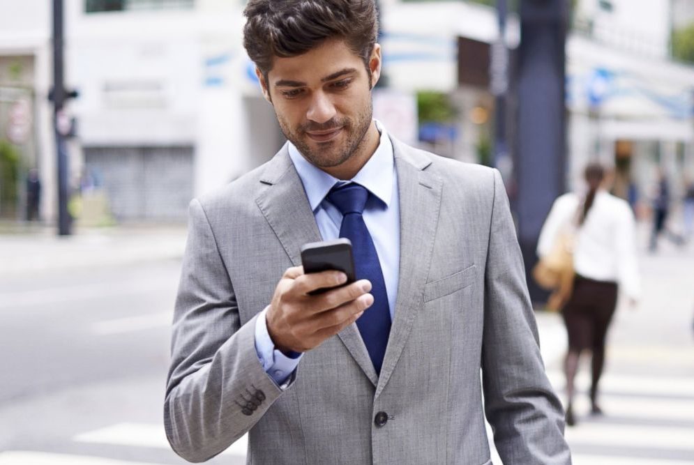 A man checks a text messaged he received following a recent hospital visit.